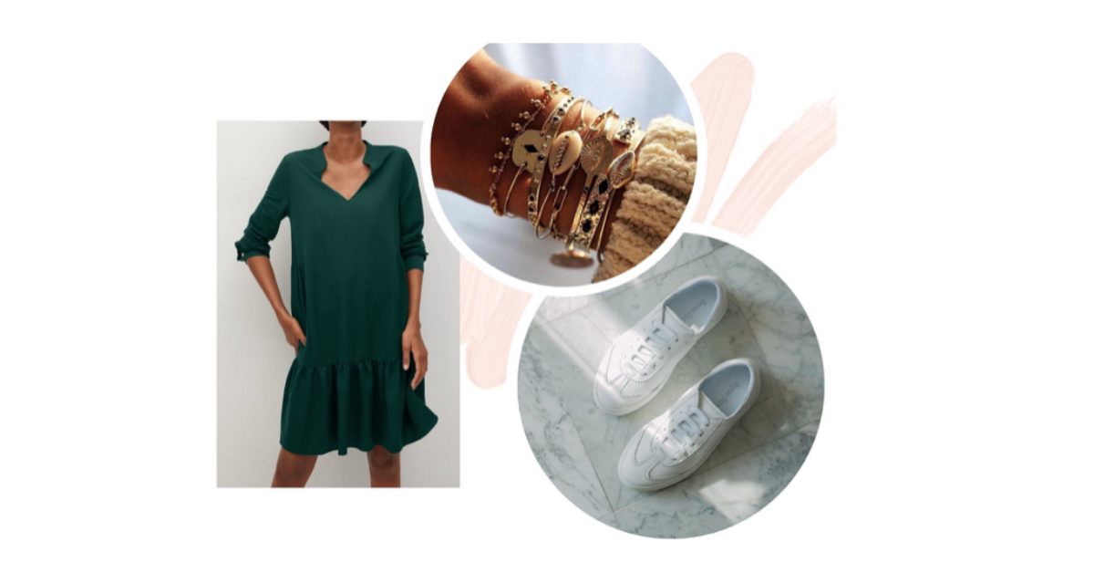 Dark green drop-hem shirt dress with stacked charm bracelets and white leather trainers