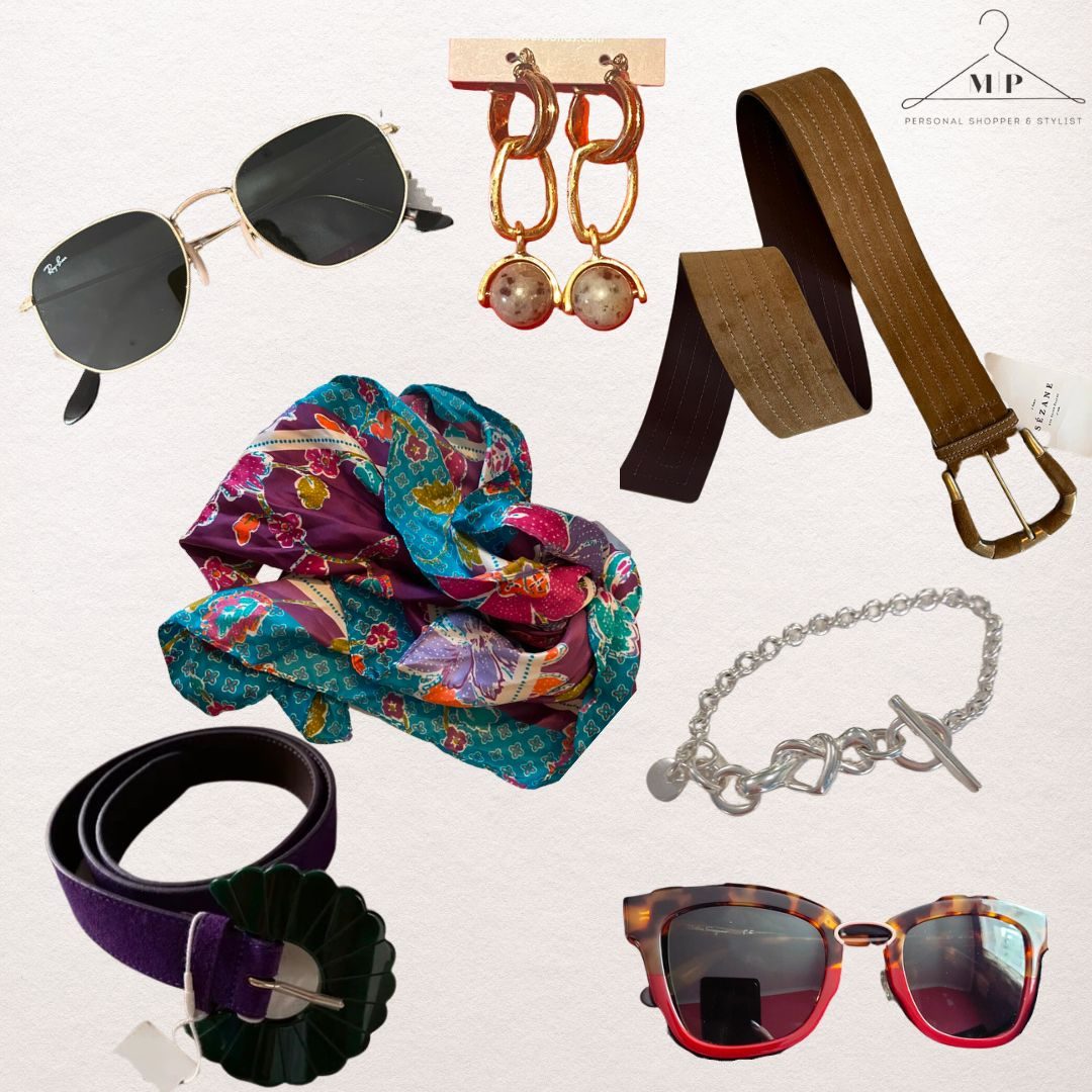 Accessories flat-lay: gold aviator sunglasses, chain drop earrings, a tan suede belt, a jewel-print silk scarf, a silver chain bracelet, a purple belt and tortoiseshell sunglasses