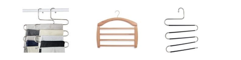 A wooden trouser hanger with four rails for hanging several pairs from one hook
