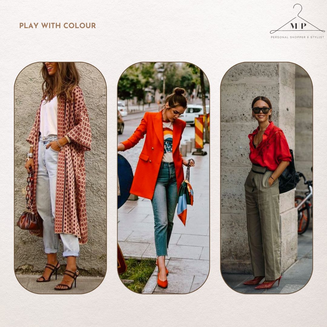 Three outfits built on colour: a printed kimono with white jeans, a red-orange coat with jeans and matching heels, and a red satin shirt with olive trousers