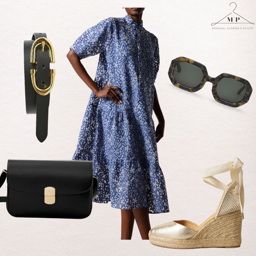 Blue and white paisley-print tiered midi shirt dress with a black and gold buckle belt, tortoiseshell sunglasses, a black crossbody bag and gold espadrille wedges