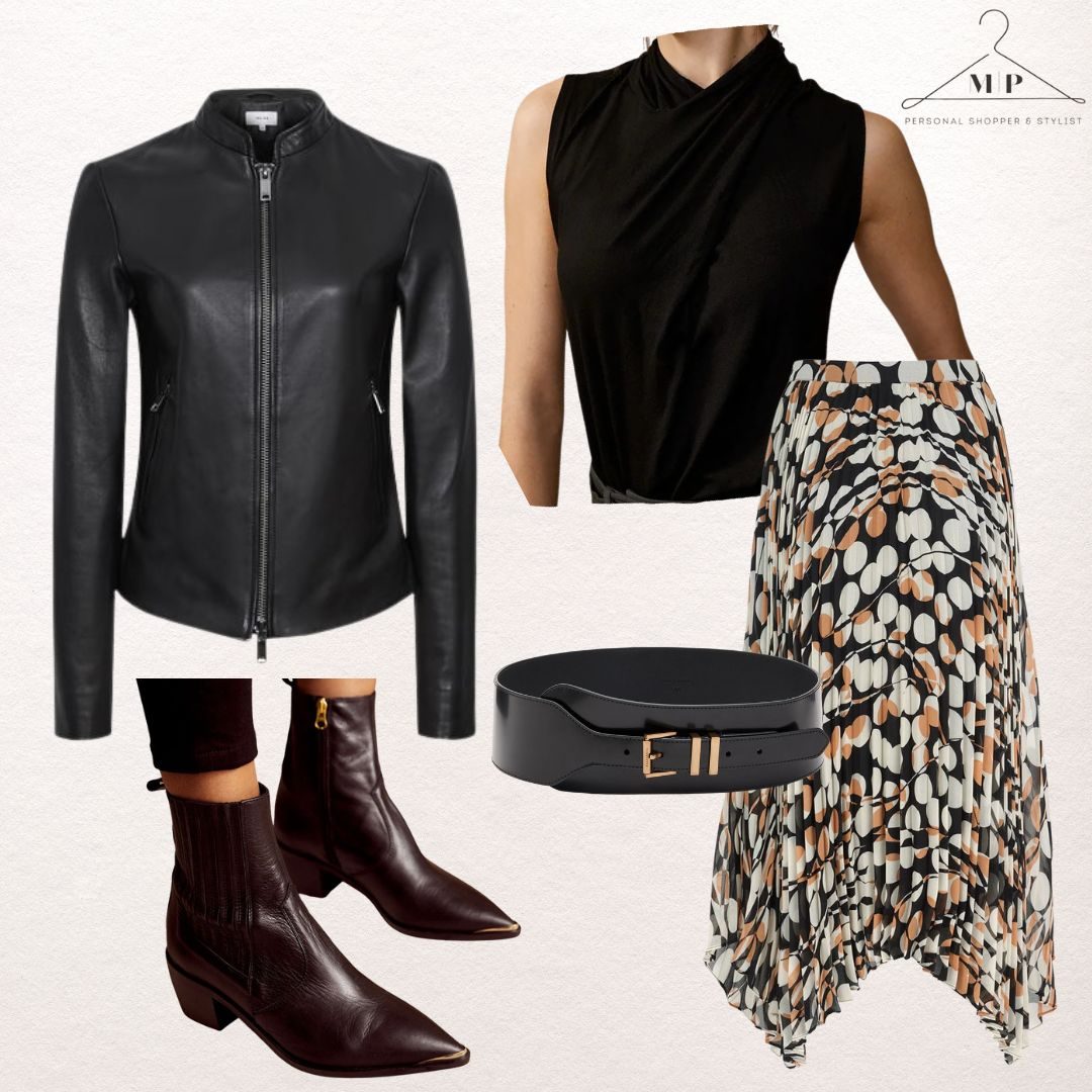 Black collarless leather jacket with a black sleeveless twist top, a printed asymmetric midi skirt, a black and gold belt and burgundy pointed ankle boots
